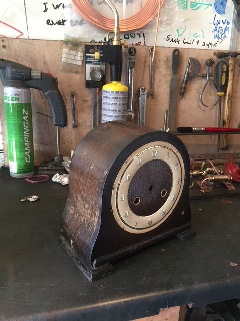 Brass and copper parts laid out for Doctor Who inspired clock