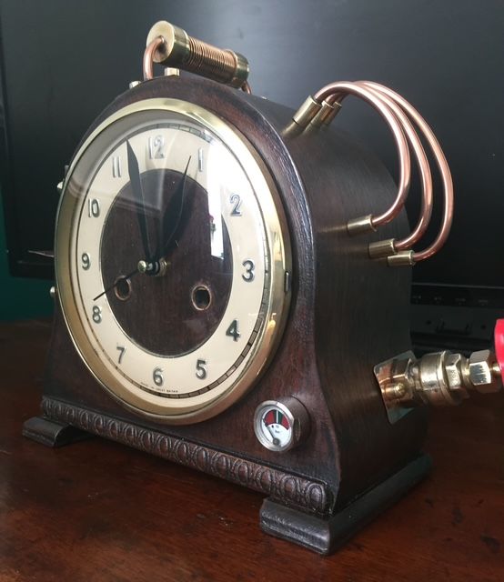 Copper pipe detailing on vintage steampunk clock left angle