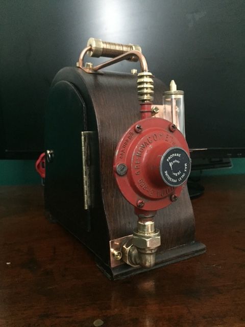 Rear valve and tubing on steampunk style vintage clock
