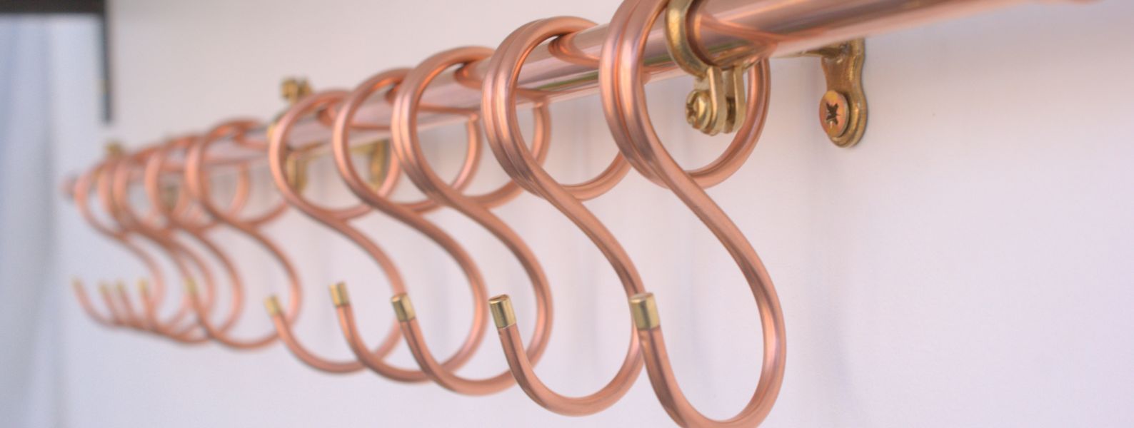 Contemporary copper rail with minimalist hook design, 36-inch