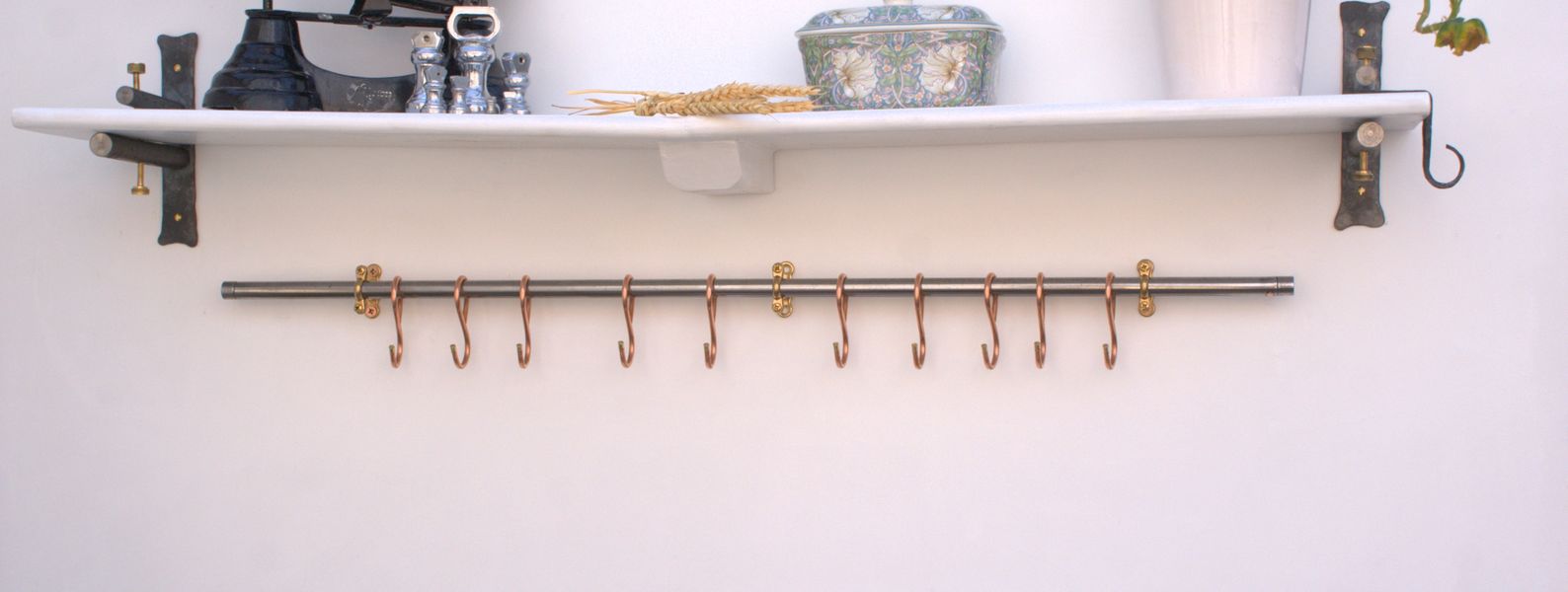 36-inch steel skillet rack with 10 French-style copper hooks