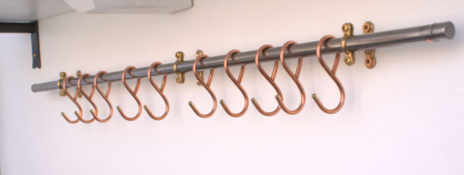 Wall-mounted 36-inch steel pan rack with hand-forged copper hooks