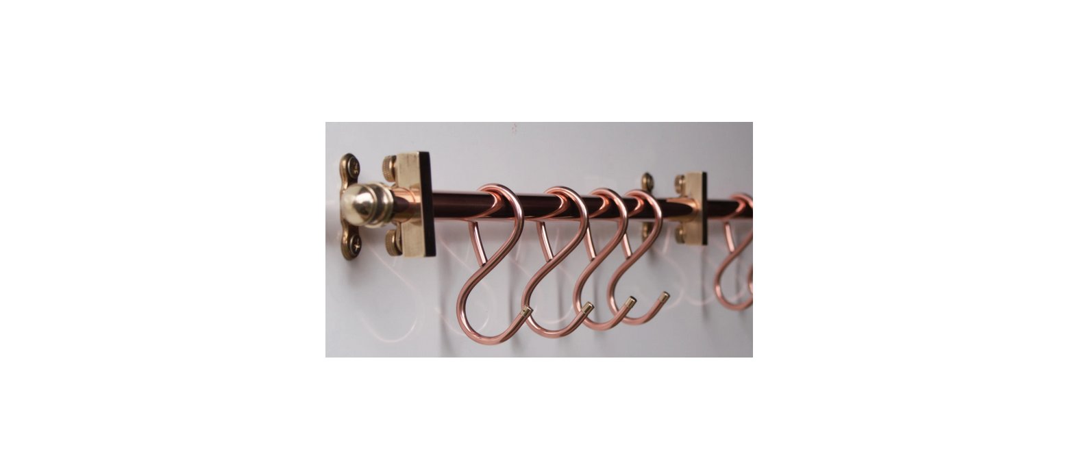 36-inch copper pan rack with brass acorn ends