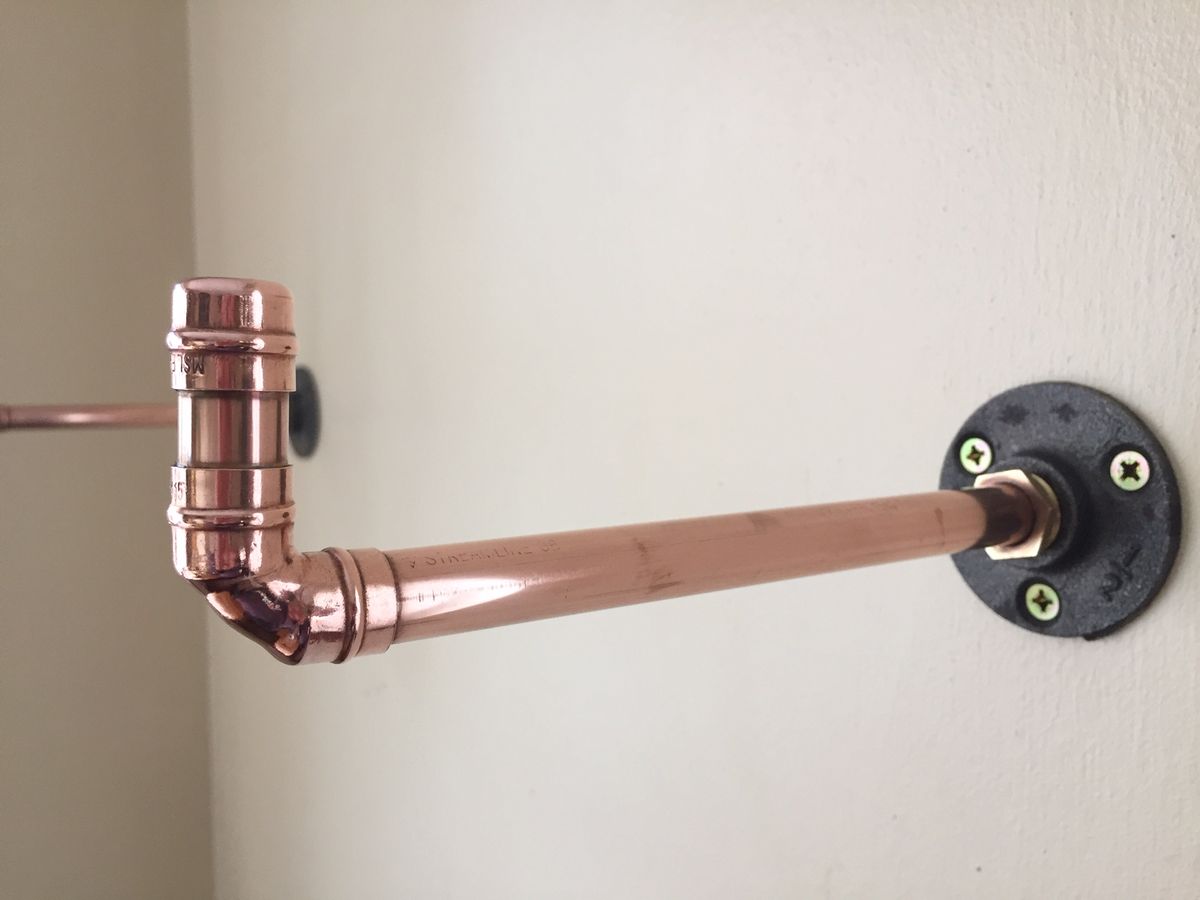 Industrial style copper shelf bracket with a foot
