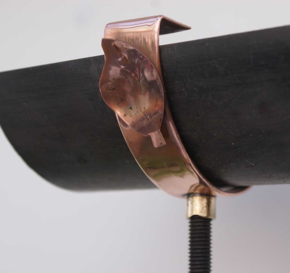 handmade copper gutter support scroll leaf