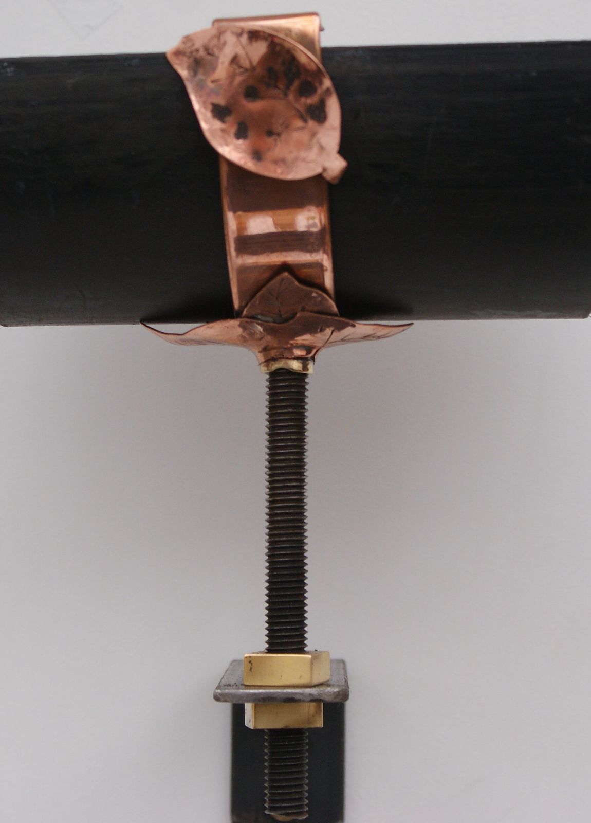 handmade copper downpipe bracket leaves